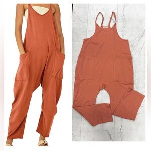 NWOT- v-neck jumper size small. Color: coral